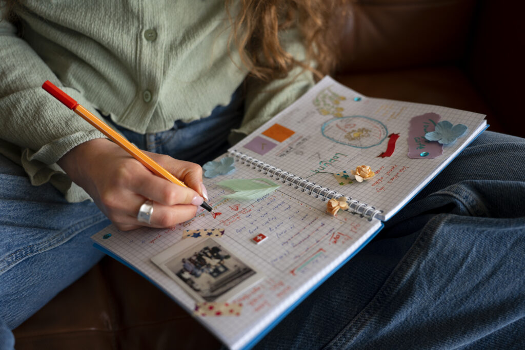 front-view-woman-doing-creative-journaling